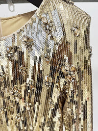 فستان ذهبي مزين بالترتر